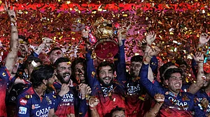 AP : Royal Challengers Bengaluru players celebrate with the winners trophy after their win in the Indian Premier League 2025 final against Punjab Kings at Narendra Modi Stadium in Ahmedabad.
