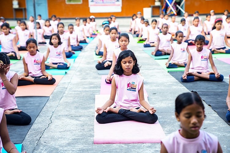 Young girls participating in a Yoga activity