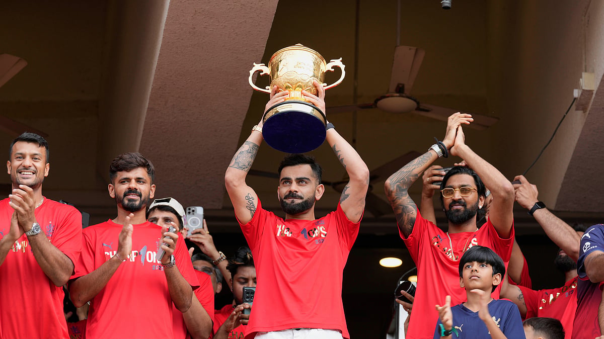 (AP Photo/Aijaz Rahi)
 : Royal Challengers Bengaluru's Virat Kohli displays the Indian Premier League winners' trophy to the fans at the M. Chinnaswamy Stadium in Bengaluru, India, Wednesday, June 4, 2025. 


