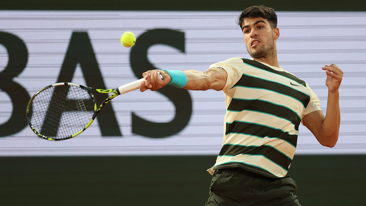 Carlos Alcaraz in action at Roland Garros 2025. 