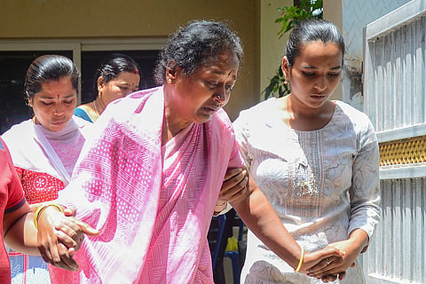 Relatives and friends pay tribute to a victim in Bengaluru