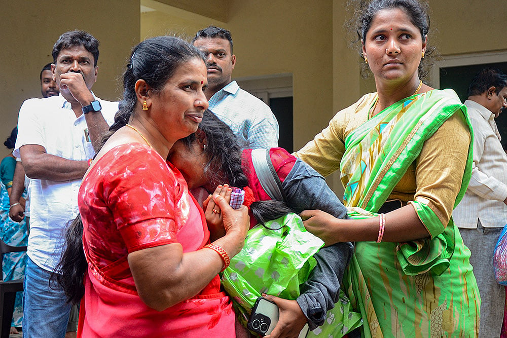 Relatives and friends pay tribute to a victim in Bengaluru