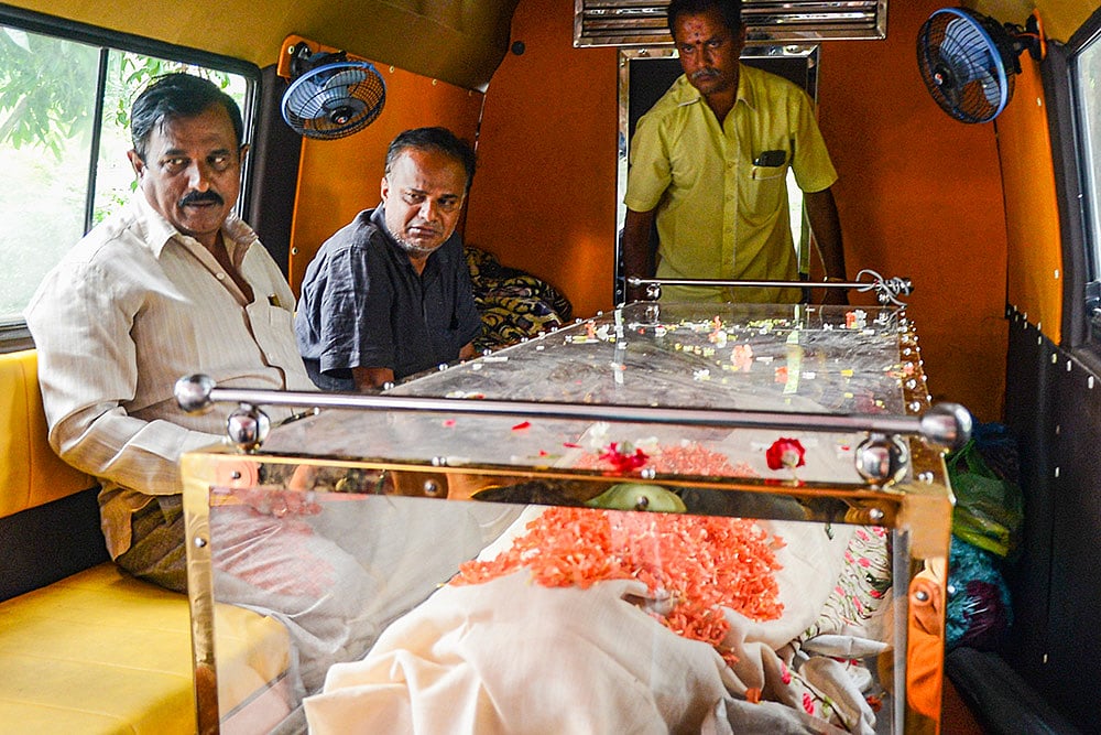Stadium stampede: Relatives and friends pay tribute to a victim in Bengaluru