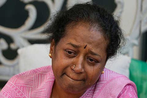 Relatives and friends pay tribute to a victim in Bengaluru