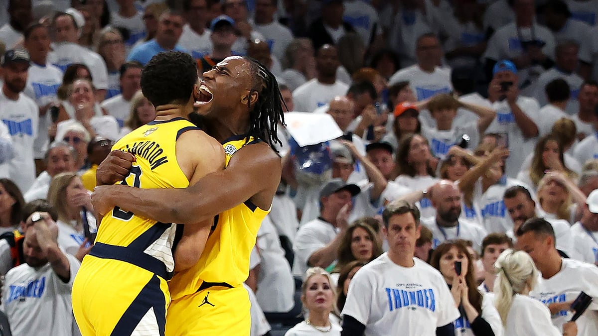 Tyrese Haliburton of the Indiana Pacers congratulated by Aaron Nesmith #23 after scoring a basket 