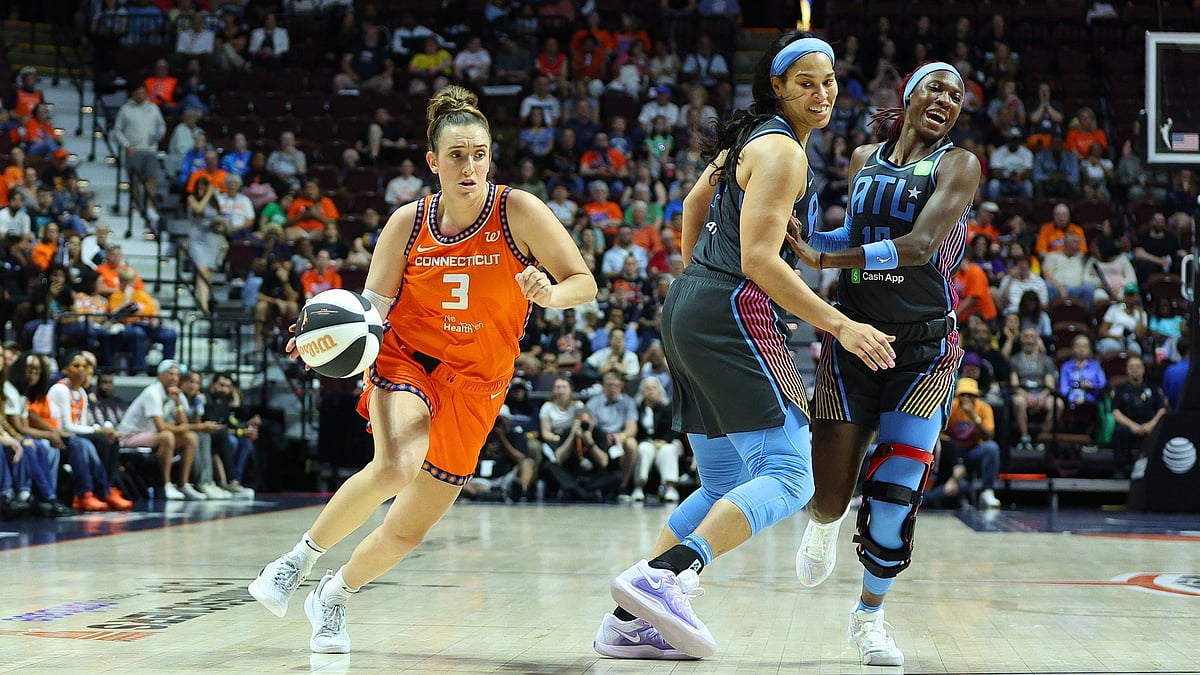Connecticut Sun guard Marina Mabrey (3) drives past Atlanta Dream forward Brionna Jones (24) and Atlanta Dream guard Rhyne Howard (10) during the WNBA Commissioners Cup game between Atlanta Dream and Connecticut Sun on June 6, 2025, at Mohegan Sun Arena in Uncasville, CT. - null