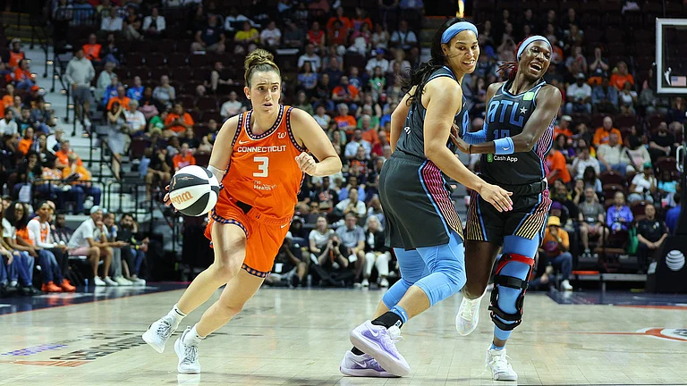 Connecticut Sun guard Marina Mabrey (3) drives past Atlanta Dream forward Brionna Jones (24) and Atlanta Dream guard Rhyne Howard (10) during the WNBA Commissioners Cup game between Atlanta Dream and Connecticut Sun on June 6, 2025, at Mohegan Sun Arena in Uncasville, CT. - null