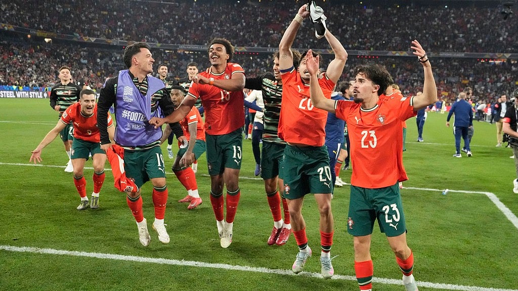 AP/Martin Meissner : Portugal players celebrate after winning the Nations League final soccer match between Portugal and Spain at the Allianz Arena in Munich, Germany.