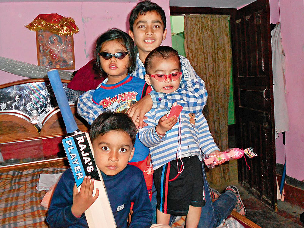 Vaibhav (holding the bat) along with his brothers and friends at his residence