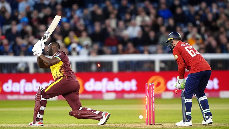 West Indies Andre Russell is bowled out by Englands Jacob Bethell. AP