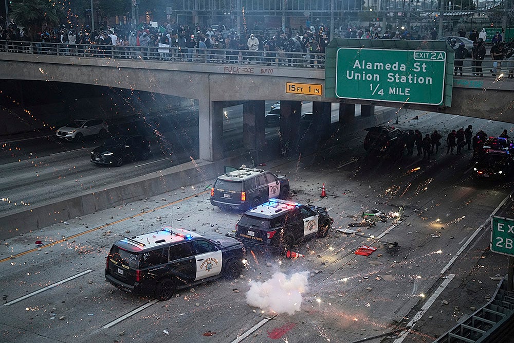 AP : A flash bomb explodes on near the metropolitan detention centre of downtown Los Angeles 