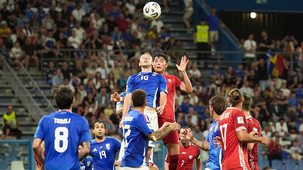 Photo: Massimo Paolone/LaPresse via AP : Italy's Davide Frattesi, centre left, and Moldova's Daniel Dumbravanu in action during the FIFA World Cup 2026 qualifiers at the Mapei Stadium in Reggio Emilia, Italy.