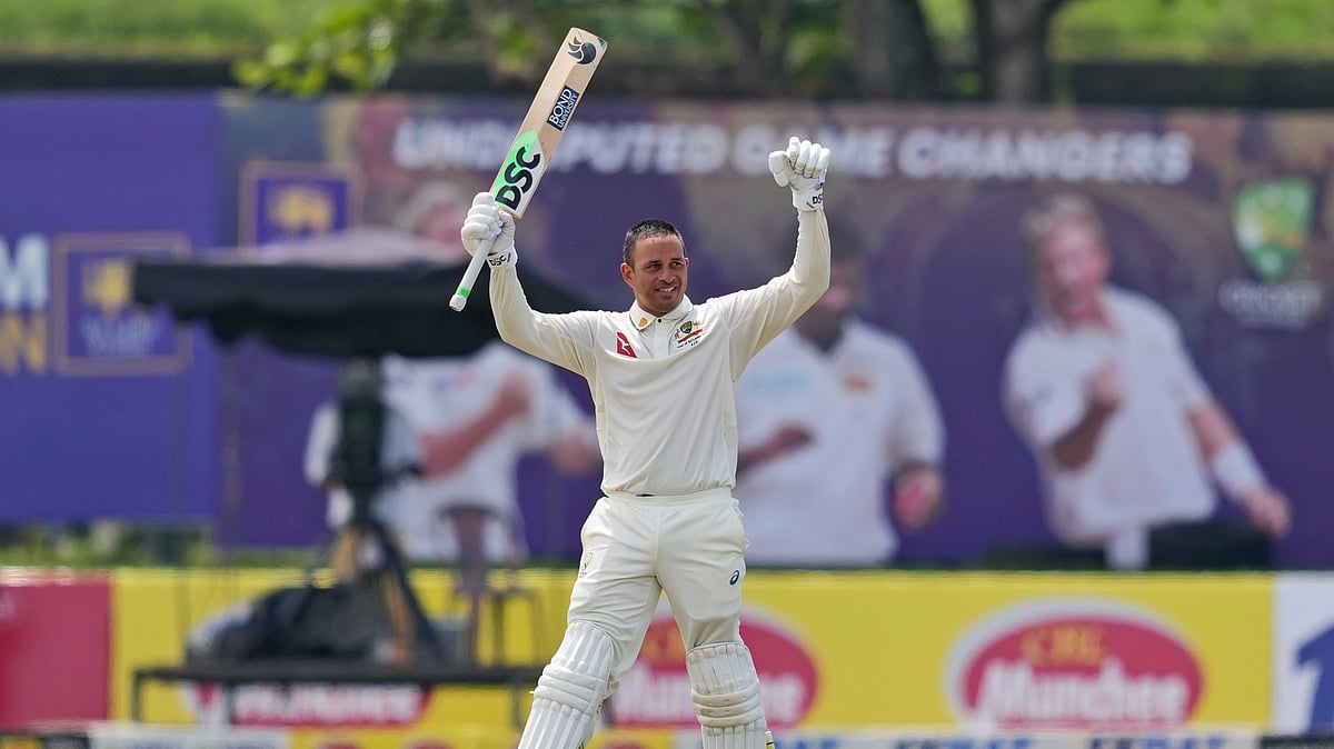AP Photo : Australia's Usman Khawaja celebrates after scoring a double century.