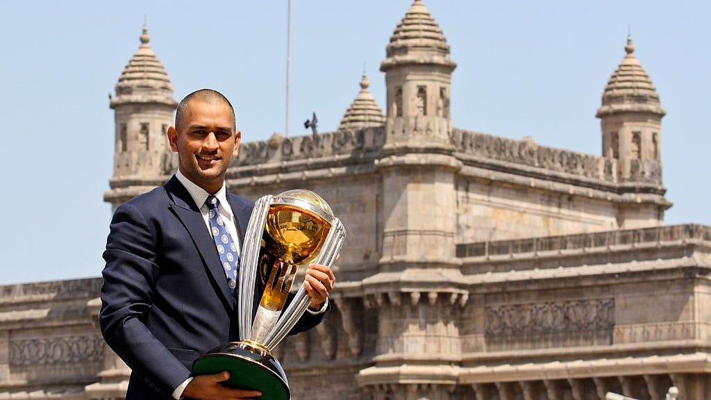 X/ICC : MS Dhoni with the ICC Cricket World Cup trophy