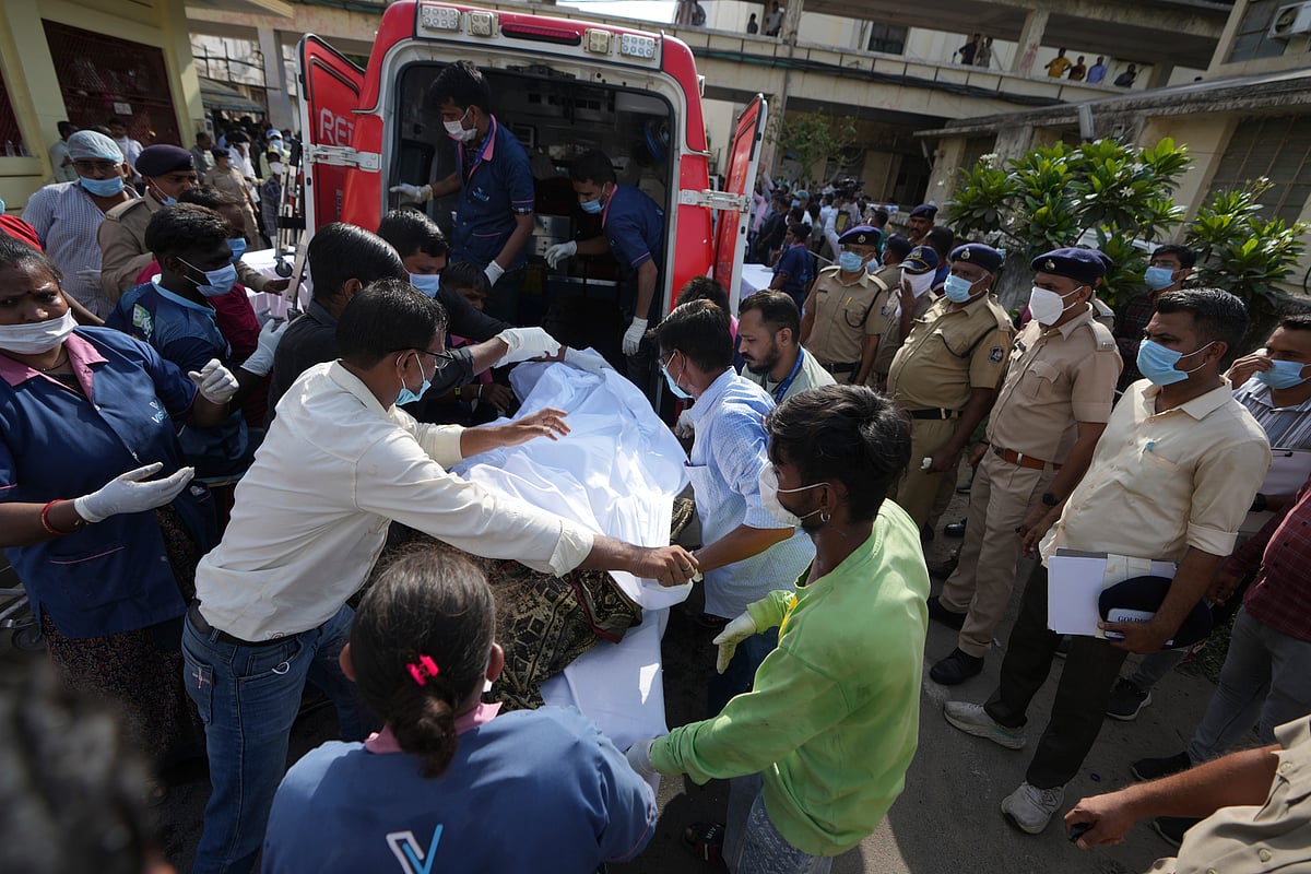 Remains of victims are brought to Civil Hospital after the Air India plane crash on June 12 - AP Photo/Ajit Solanki