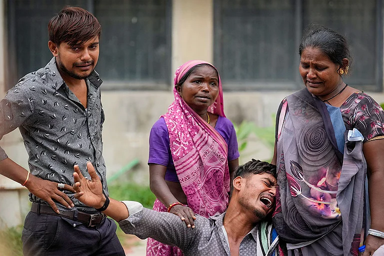 Ahmedabad plane crash: Victim's family mourns - | Photo: PTI/Kunal Patil