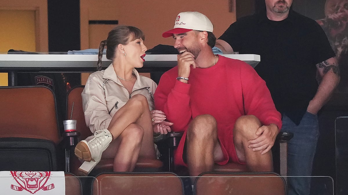 Singer Taylor Swift, left, and Kansas City Chiefs football player Travis Kelce, front right, take in the third period in Game 4 of the NHL hockey Stanley Cup Final between the Edmonton Oilers and the Florida Panthers in Sunrise, Fla., Thursday, June 12, 2025. -  (Nathan Denette/The Canadian Press via AP)