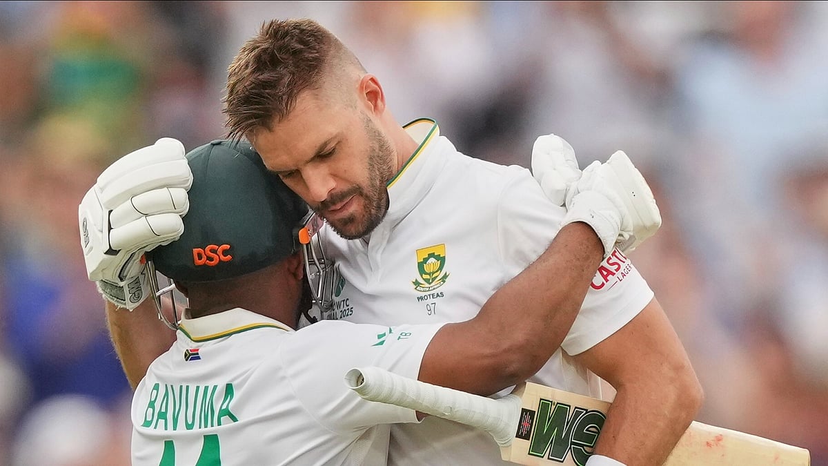 (AP Photo/Kirsty Wigglesworth) : South Africa's Aiden Markram, right, celebrates with batting partner Temba Bavuma after scoring a century on day three of the World Test Championship final between South Africa and Australia at Lord's cricket ground in London, Friday, June 13, 2025. 