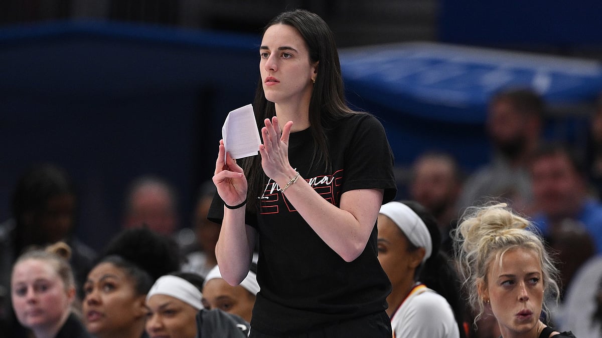 An injured Caitlin Clark cheers on the Indiana Fever vs. the Chicago Sky on June 7, 2025.