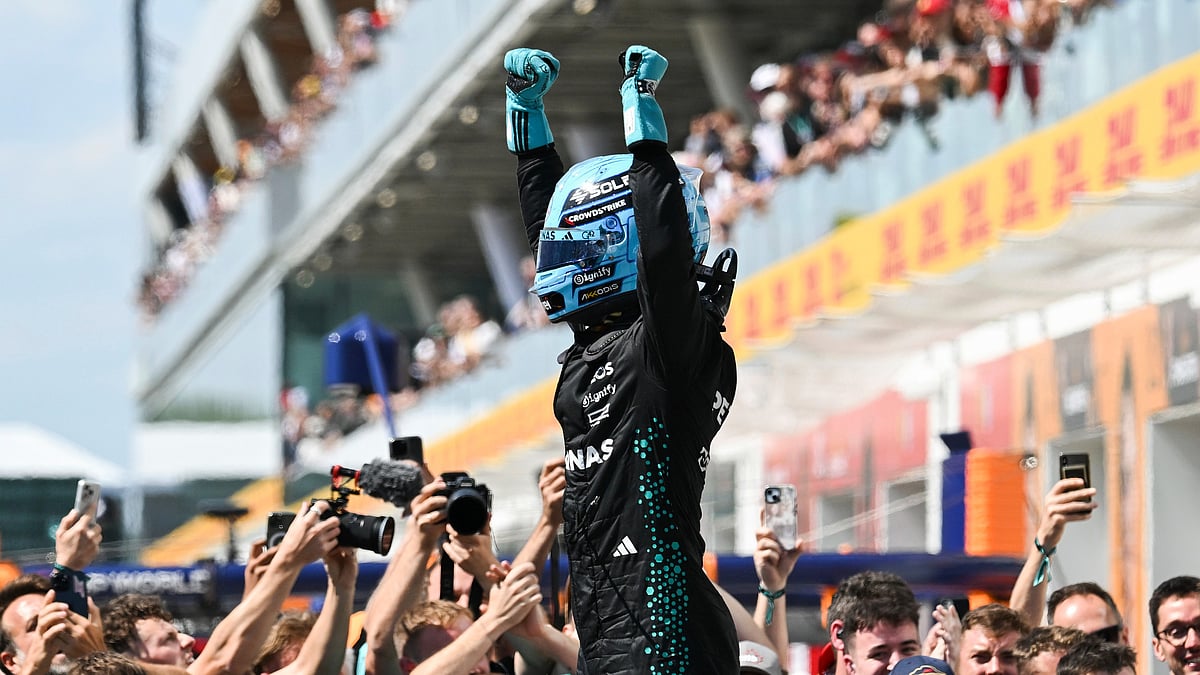 Graham Hughes/The Canadian Press via AP : Mercedes driver George Russell, of the United Kingdom, reacts after winning the F1 Canadian Grand Prix auto race in Montreal, Sunday, June 15, 2025.