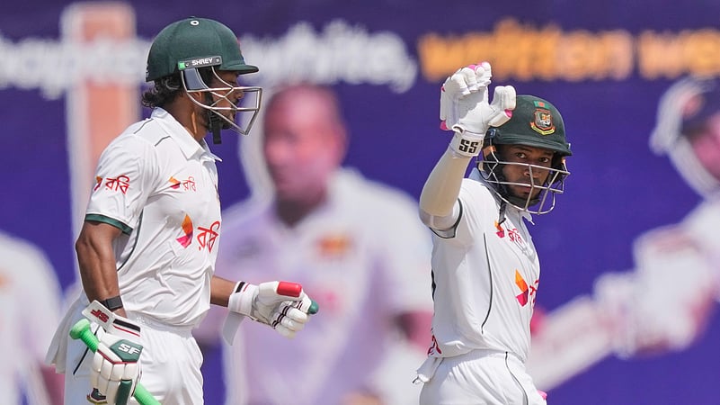 Bangladeshs Mushfiqur Rahim, right, celebrates his fifty runs. AP Photo
