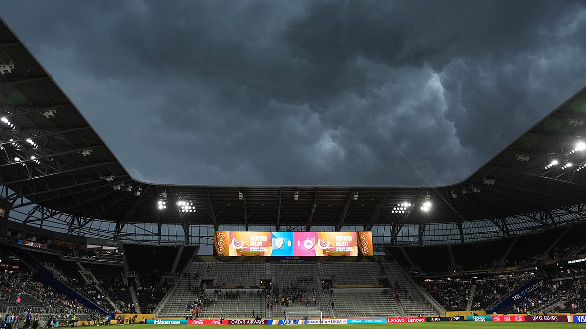 AP Photo/Joshua A. Bickel : Storm clouds move over the stadium during the Club World Cup group H football match between CF Pachuca and FC Salzburg in Cincinnati.