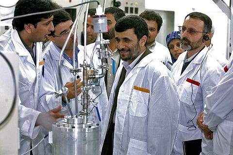 TEHRAN, IRAN - APRIL 8: Iranian President Mahmoud Ahmadinejad (C) visits the Natanz uranium enrichment facilities April 8, 2008 200 miles (322 km) south of the Tehran, Iran. Ahmadinejad announced on Iranian state television during the visit that Iran has begun the installation of some 6,000 new centrifuges, adding to to the 3,000 centrifuges already at the facility. 