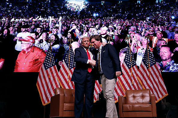 | Getty Images | : Tucker Carlson with U.S. President Donald Trump