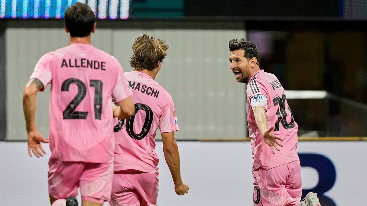 (AP Photo/Brynn Anderson) : Inter Miami's Lionel Messi, right, celebrates after scoring his side's second goal during the Club World Cup group A soccer match between Inter Miami and FC Porto in Atlanta, Thursday, June 19, 2025.