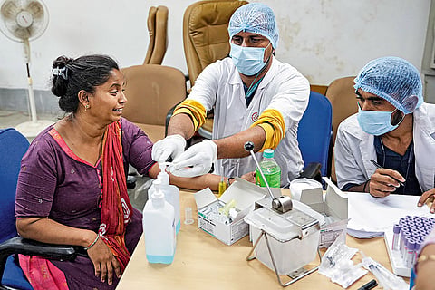 Mandatory Procedure: A family member of one of the victims of the crash breaks down while giving her DNA sample at the centre set up inside the Civil Hospital 