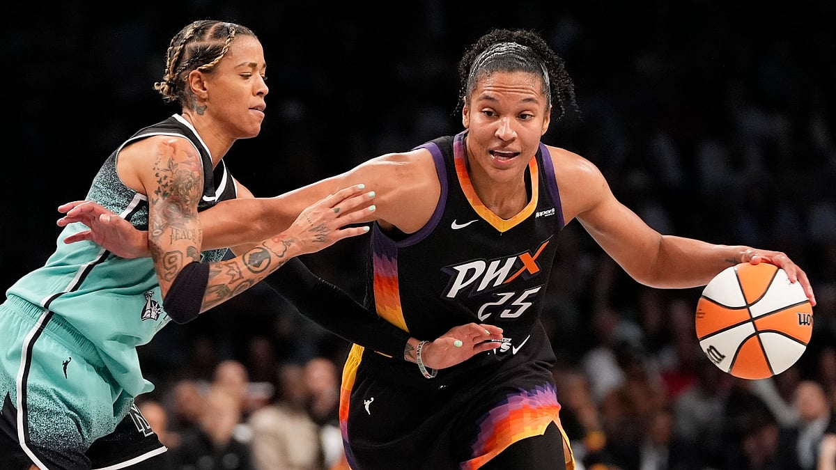 Alyssa Thomas #25 of the Phoenix Mercury dribbles the ball against Natasha Cloud #9 of the New York Liberty during the second half of the game at Barclays Center on June 19, 2025 in New York City. - null