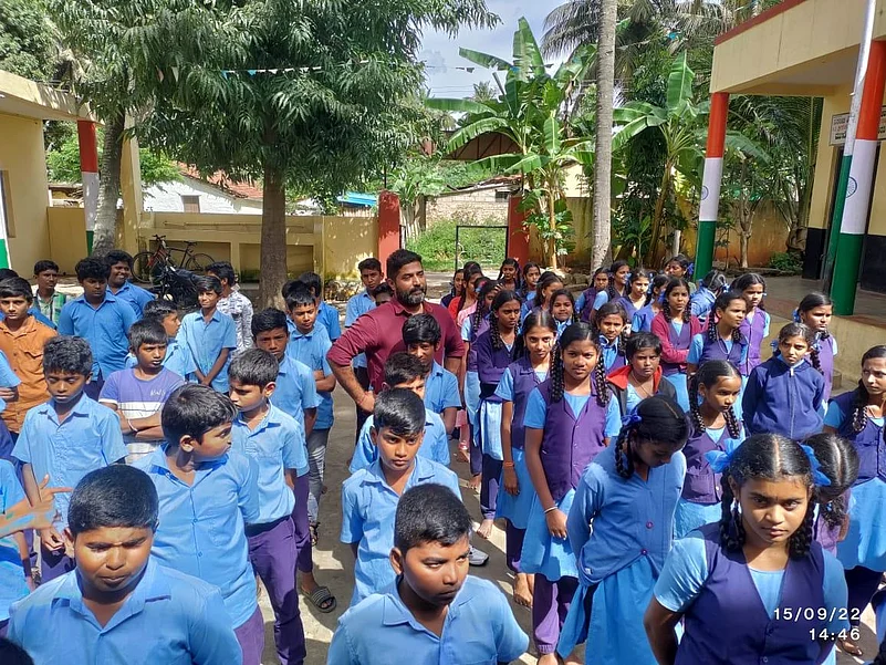 Students are standing in their school uniforms