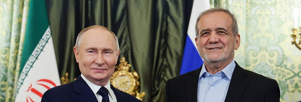 Vyacheslav Prokofyev : Russian President Vladimir Putin, left, and Iranian President Masoud Pezeshkian pose for a photo during their meeting at the Kremlin in Moscow, Russia, on Jan. 17, 2025