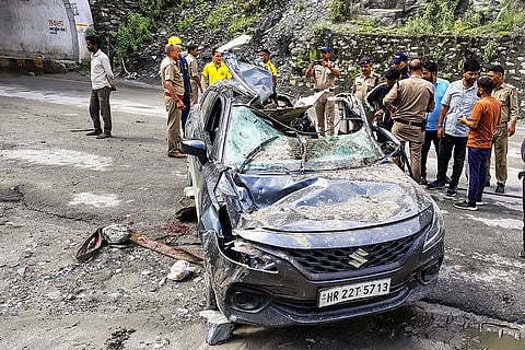 Stone falls on car
