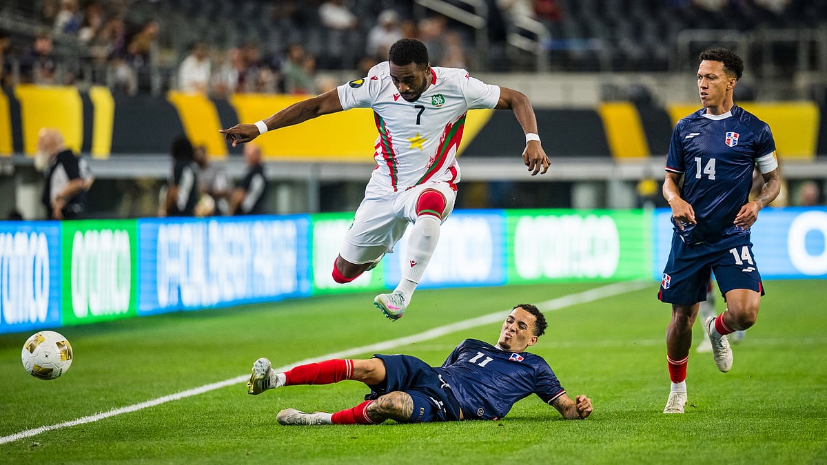  (AP Photo/Jessica Tobias)

 : Suriname forward Gyrano Kerk (7) jumps over Dominican Republic forward Edarlyn Reyes (11) during a CONCACAF Gold Cup soccer match Sunday, June 22, 2025, in Arlington, Texas.
