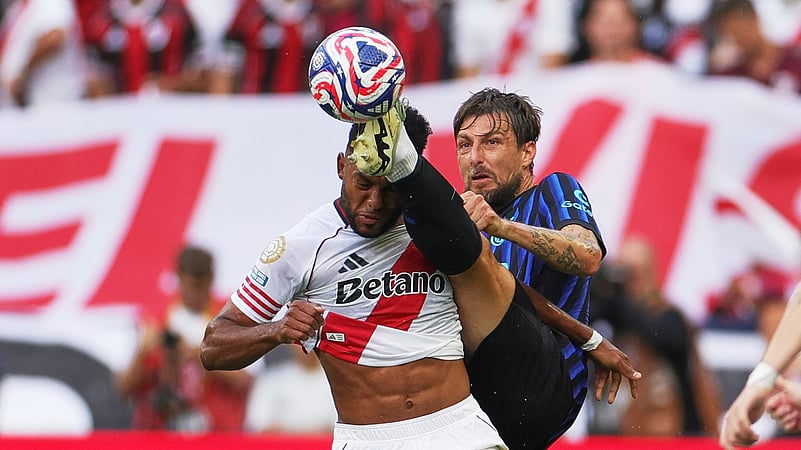 Inter Milans Francesco Acerbi kicks at the ball as River Plates Miguel Borja. AP