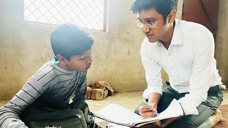 Vipul Jain with a student