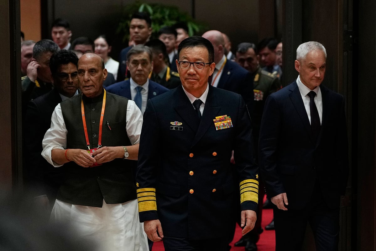 AP Photo/Ng Han Guan : Chinese Defense Minister Dong Jun, center leads other heads of defense including at left, Indian Defence Minister Rajnath Singh and Russian Defense Minister Andrei Belousov at right, as they visit the Shanghai Cooperation Organization Summit Site after the Defense Ministers' Meeting of the Shanghai Cooperation Organization members states in Qingdao in eastern China's Shandong province on Thursday, June 26, 2025. 