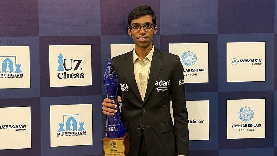X/Praggnanandhaa : R Praggnanandhaa poses with the trophy after winning the UzChess Cup Masters 2025 in Tashkent.