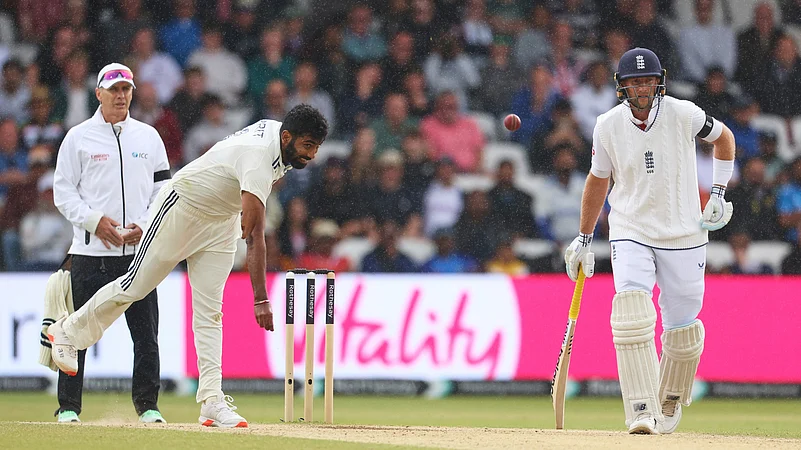 Indias Jasprit Bumrah, left, bowls a delivery on day five. AP
