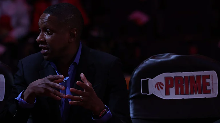 Toronto Raptors Masai Ujiri has a chat on the bench as the Toronto Raptors fall to the Miami Heat in overtime at Scotiabank Arena in Toronto. February 21, 2025. - null