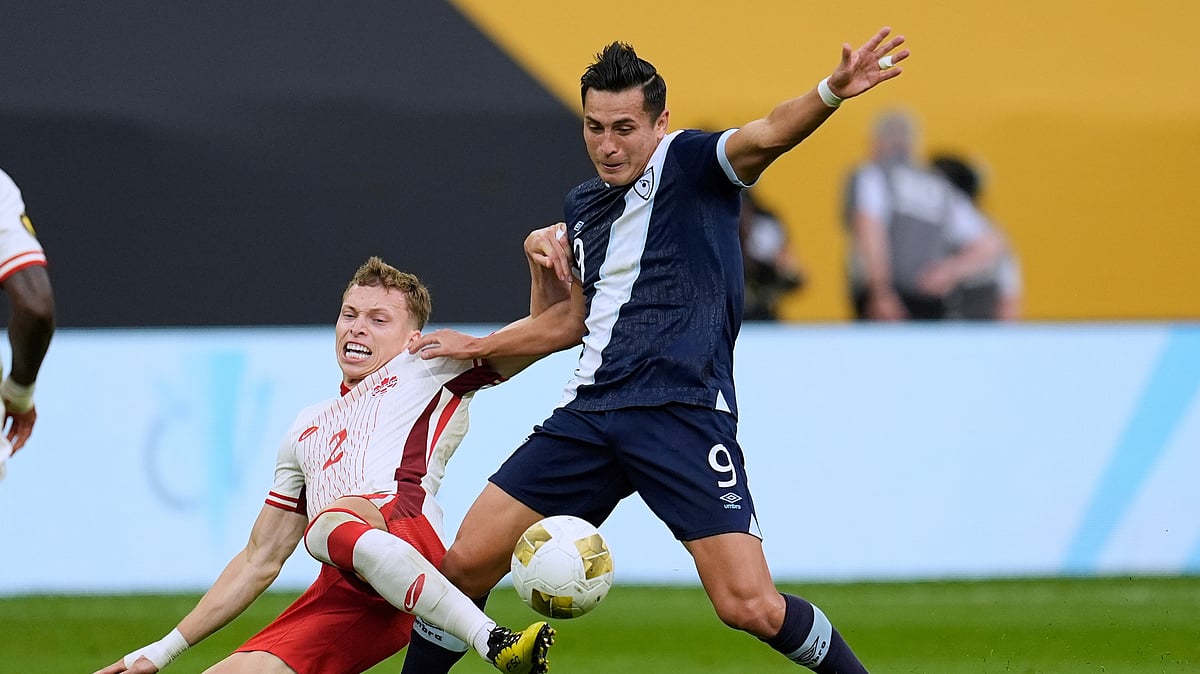 Canada defender Alistair Johnston (2) and Guatemala forward Rubio Mendez. AP