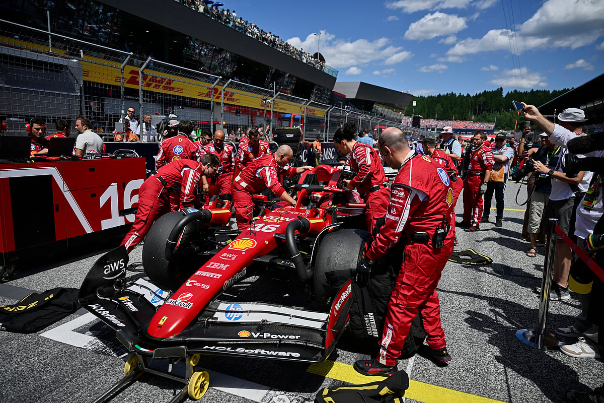 Ferrari driver Charles Leclerc of Monaco sits in his car on the starting grid before the Austrian Formula One Grand Prix in Spielberg, Austria, Sunday, June 29, 2025.

