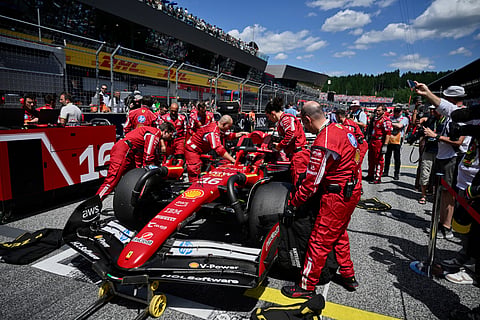 Ferrari driver Charles Leclerc of Monaco sits in his car on the starting grid before the Austrian Formula One Grand Prix in Spielberg, Austria, Sunday, June 29, 2025.

