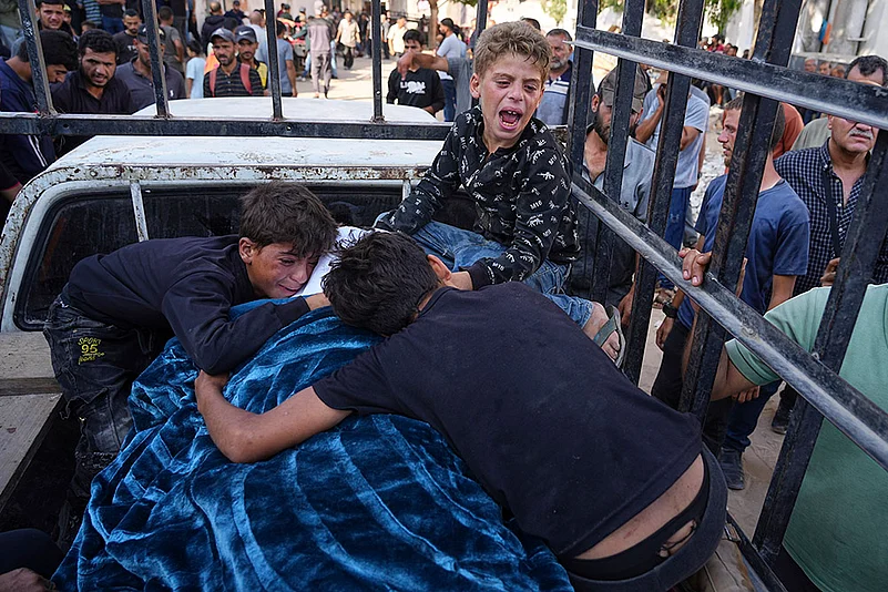 Gaza Aid seekers killed by IDF_Palestinians children mourn