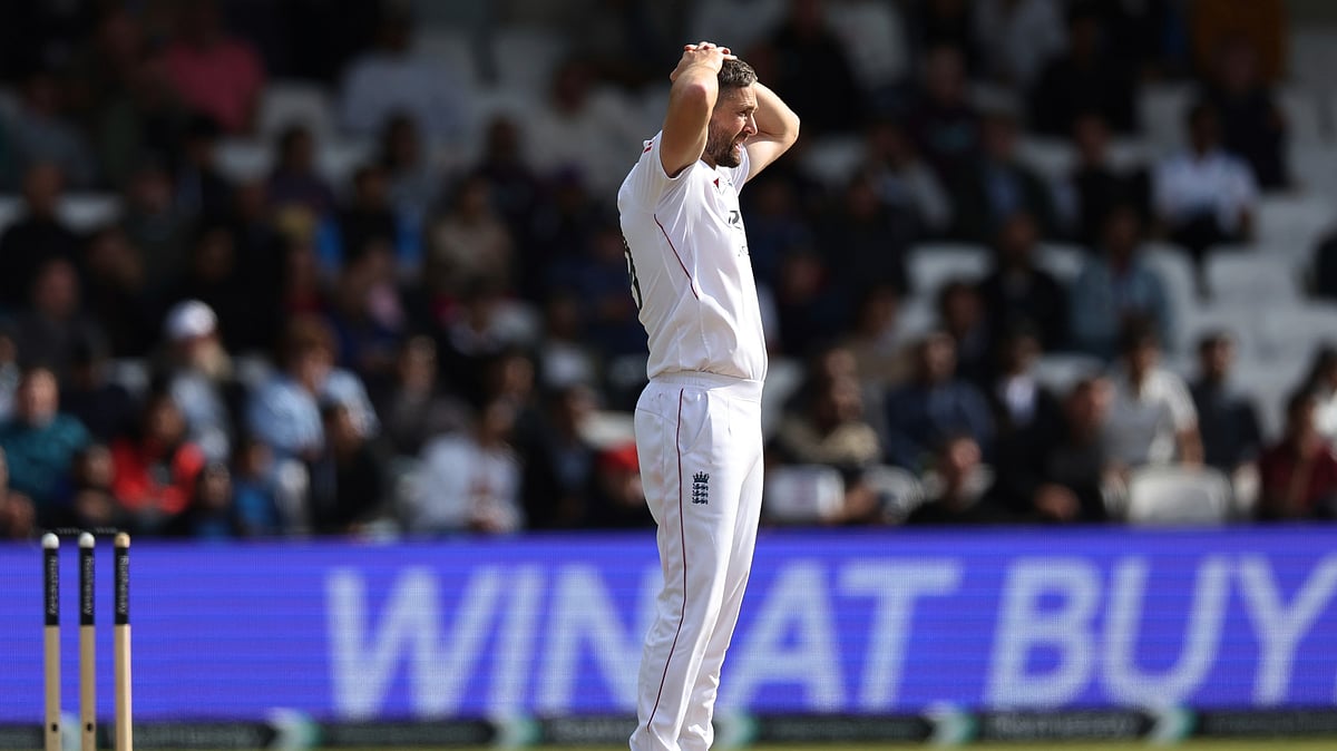 AP Photo/Scott Heppell : England's Chris Woakes reacts after bowling a delivery on day four of the first cricket test match between England and India at Headingley in Leeds, England.