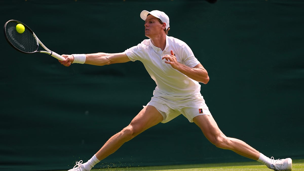 AP Photo/Kirsty Wigglesworth : Jannik Sinner of Italy plays a return to Luca Nardi of Italy during their first-round men's singles match at the Wimbledon Tennis Championships in London, Tuesday.