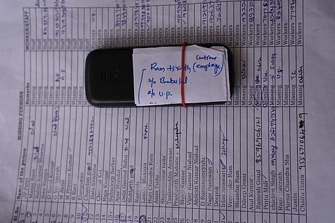  Mobile phone of one among the missing persons kept at the rescue coordination spot near the factory.