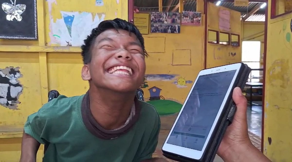 Boy smiling with app