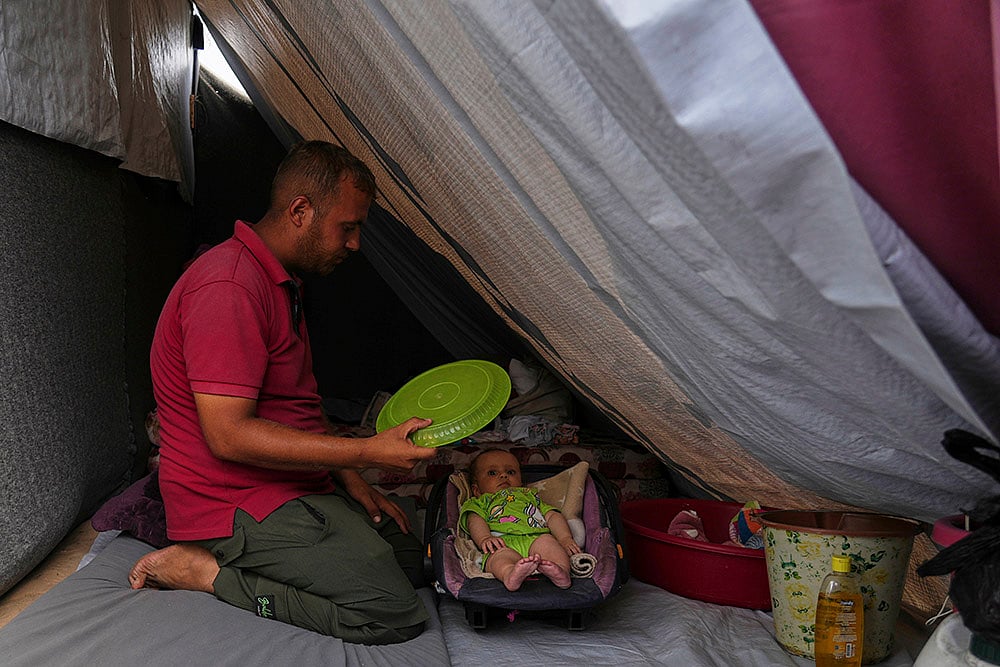 | Photo: AP/Abdel Kareem Hana : "Gaza heatwave